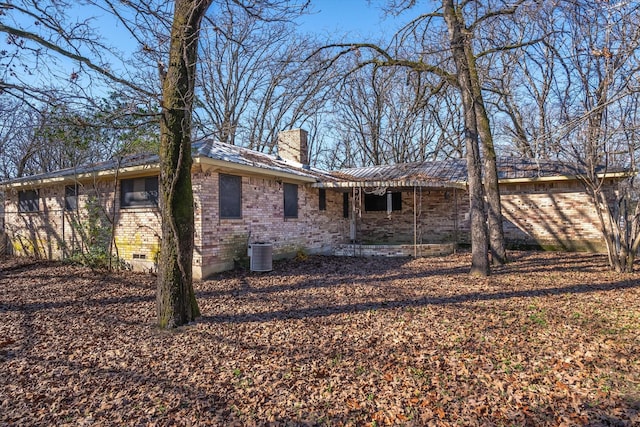 rear view of house with cooling unit