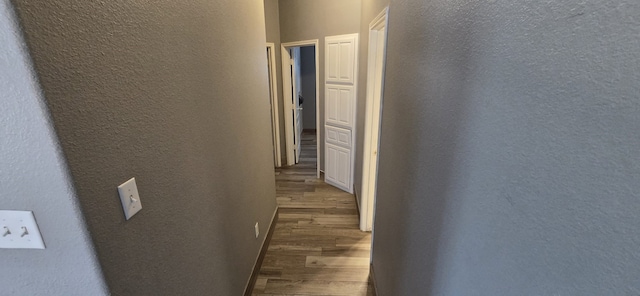 corridor with dark wood-type flooring