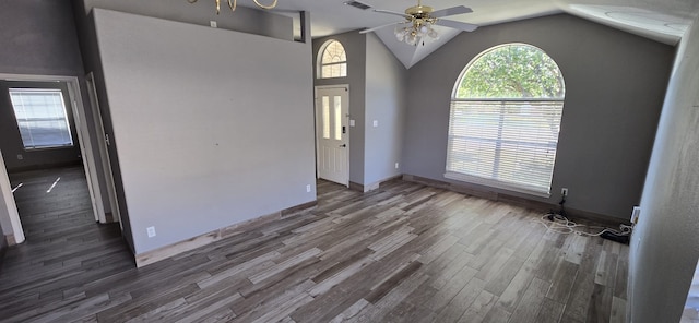 interior space with ceiling fan, dark wood-type flooring, and vaulted ceiling