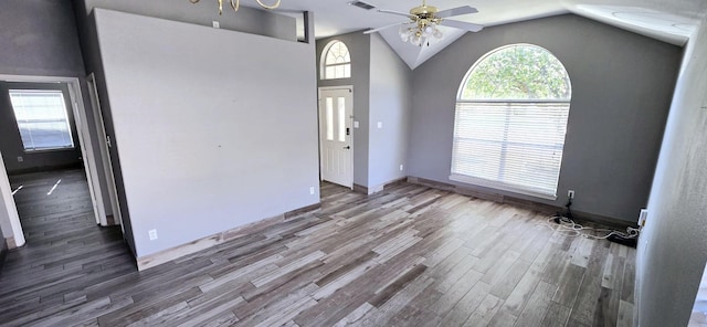 entryway with dark hardwood / wood-style floors, plenty of natural light, lofted ceiling, and ceiling fan