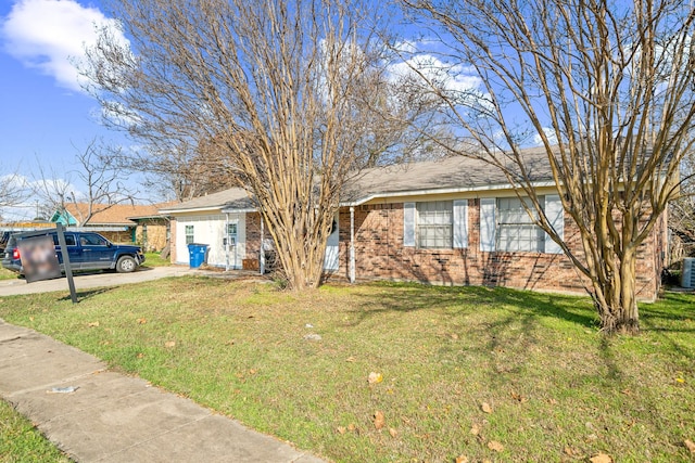 view of front facade featuring central AC and a front lawn