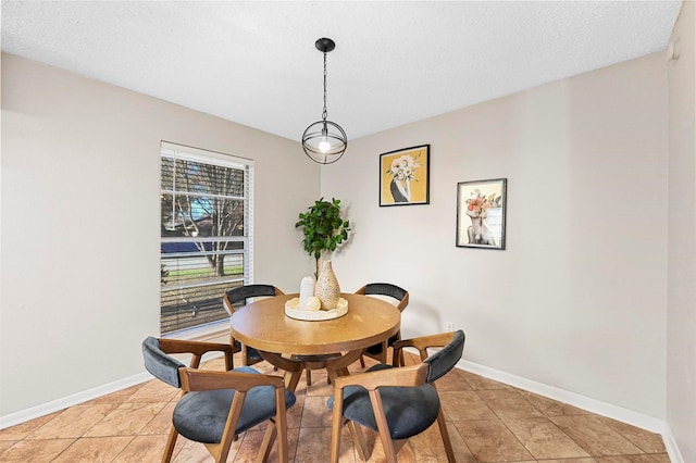 dining space featuring tile patterned floors