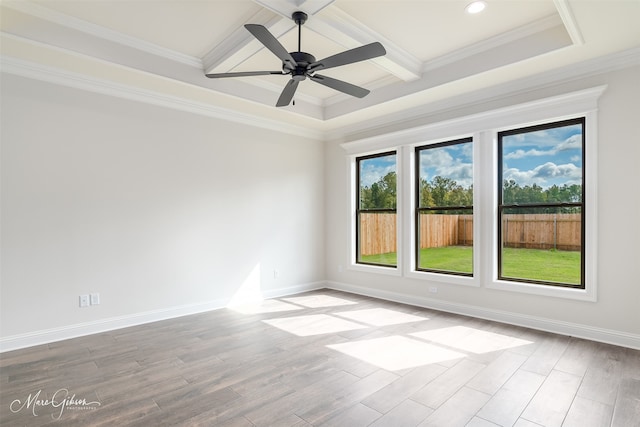 unfurnished room featuring ceiling fan, coffered ceiling, beamed ceiling, crown molding, and light wood-type flooring