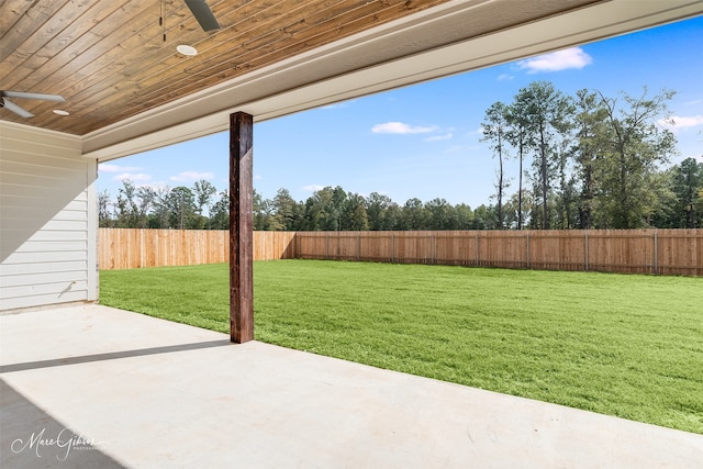 view of yard featuring a patio and ceiling fan