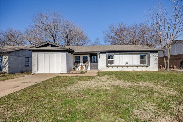 ranch-style home with a front yard and a garage