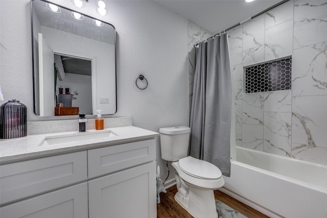 full bathroom with hardwood / wood-style flooring, vanity, shower / bathtub combination with curtain, and toilet