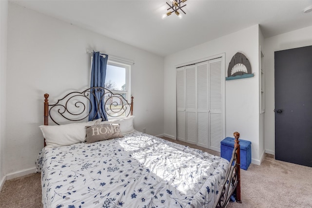 bedroom with light carpet and a closet