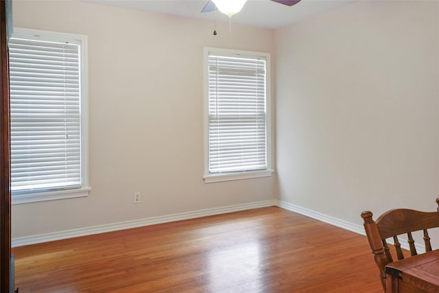 empty room featuring ceiling fan and light hardwood / wood-style flooring