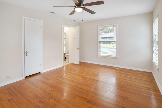 unfurnished bedroom featuring ceiling fan, light hardwood / wood-style flooring, and ensuite bathroom