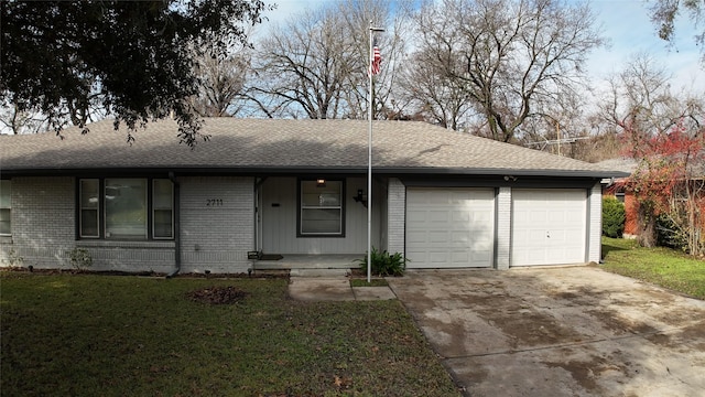 ranch-style home featuring a garage and a front yard