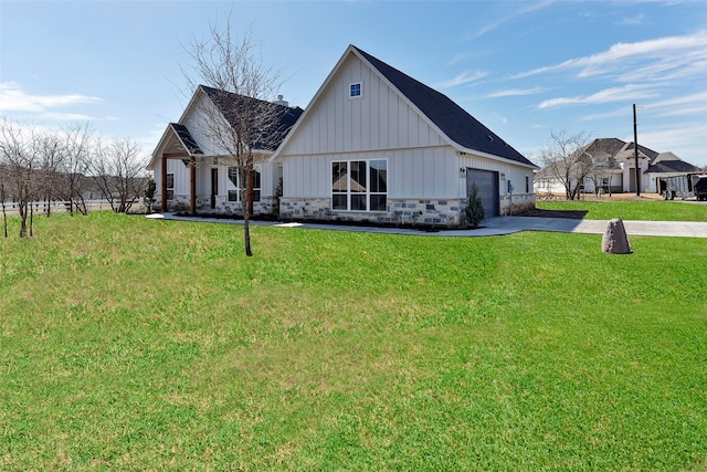 modern inspired farmhouse featuring a garage and a front yard