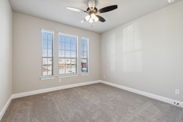 unfurnished room featuring carpet flooring and ceiling fan