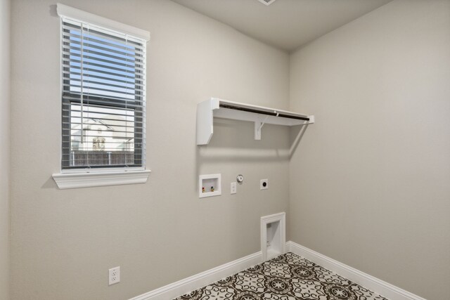 washroom featuring electric dryer hookup, hookup for a gas dryer, hookup for a washing machine, and tile patterned flooring