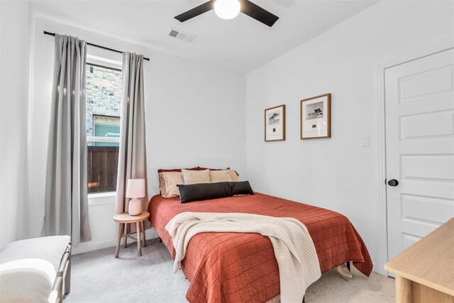 carpeted bedroom featuring ceiling fan