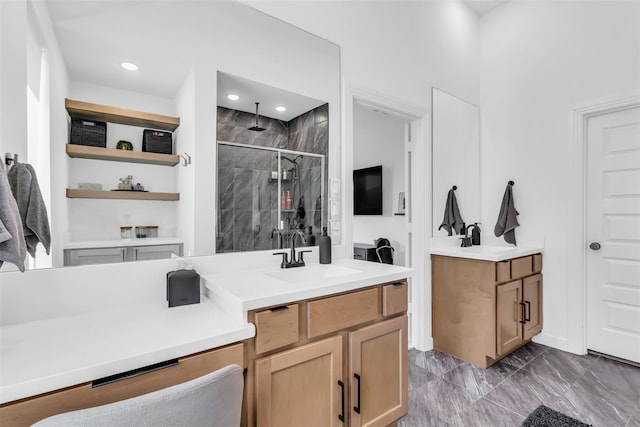 bathroom with an enclosed shower and vanity