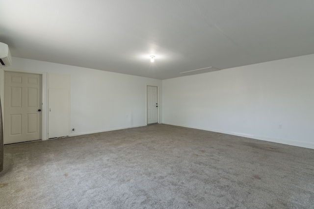 carpeted empty room featuring a wall mounted air conditioner