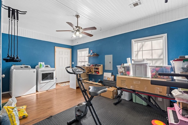 office with washer and clothes dryer, ceiling fan, a healthy amount of sunlight, and hardwood / wood-style flooring