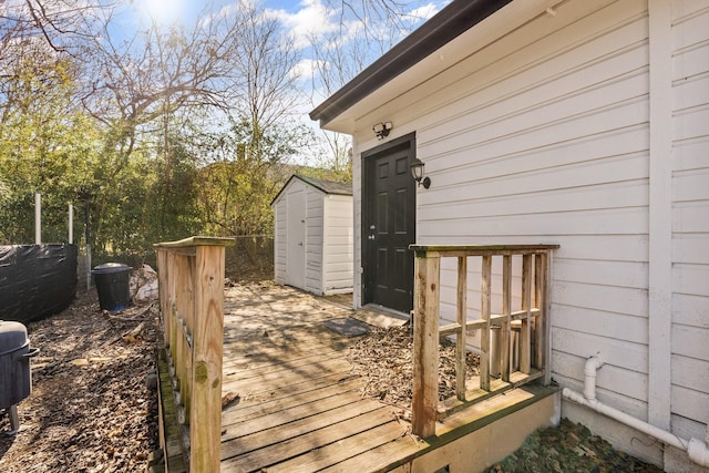 wooden terrace with a storage shed