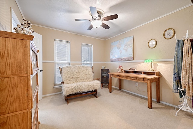 sitting room with baseboards, ornamental molding, ceiling fan, and light colored carpet