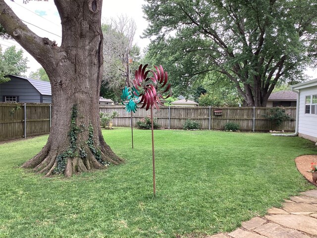 503 Mockingbird St, Bonham, TX 75418 - bedroom with tile patterned floors, brick wall, a ceiling fan, and a textured ceiling