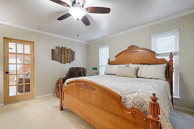 carpeted bedroom featuring ceiling fan and crown molding