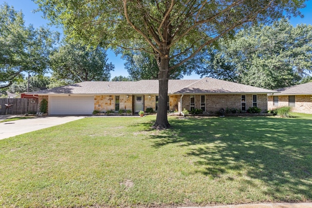 single story home with fence, a garage, a front lawn, and concrete driveway