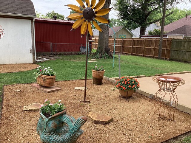 503 Mockingbird St, Bonham, TX 75418 - fenced backyard featuring a patio