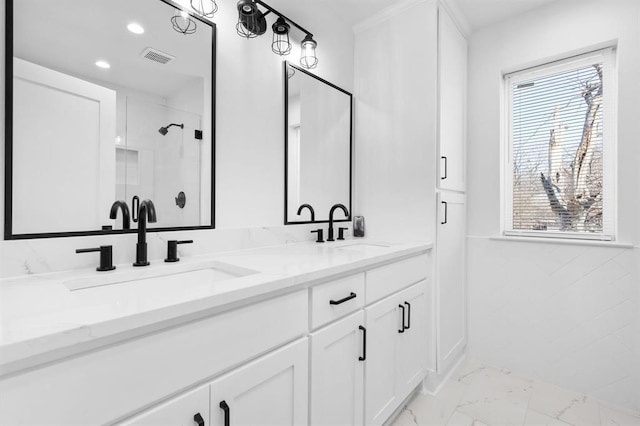 bathroom featuring vanity and a healthy amount of sunlight