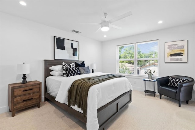 bedroom with light colored carpet and ceiling fan