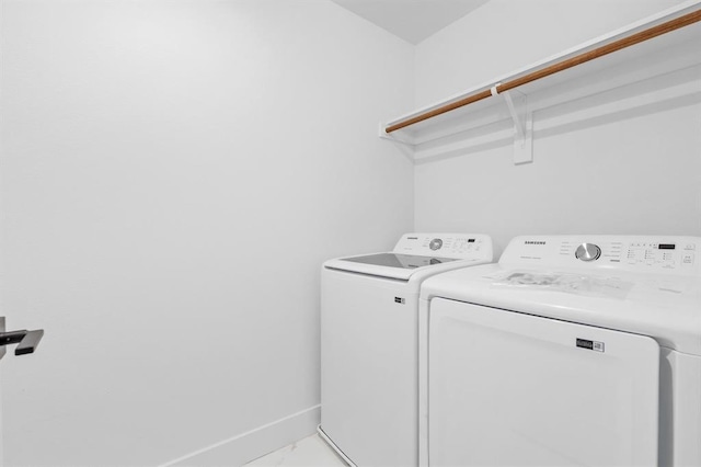 washroom with separate washer and dryer