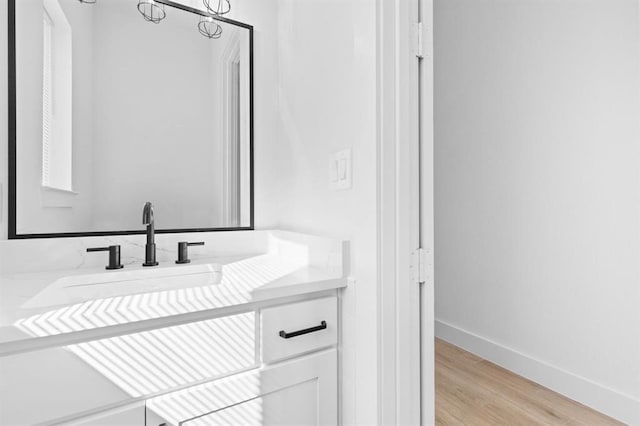 bathroom featuring vanity and wood-type flooring