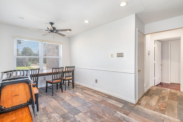 dining room featuring dark hardwood / wood-style floors and ceiling fan