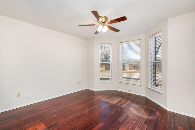 unfurnished room featuring ceiling fan and dark wood-type flooring