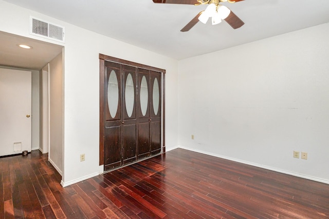 foyer featuring ceiling fan and dark wood-type flooring