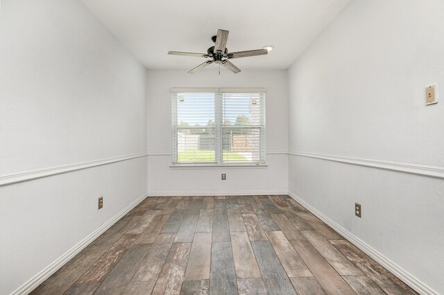 unfurnished room with ceiling fan and dark hardwood / wood-style flooring