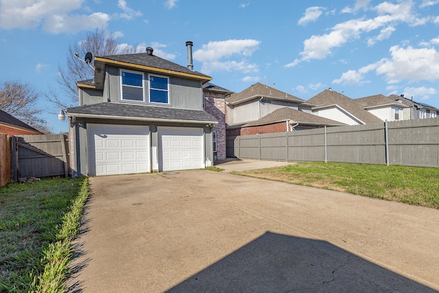 exterior space featuring a front yard and a garage