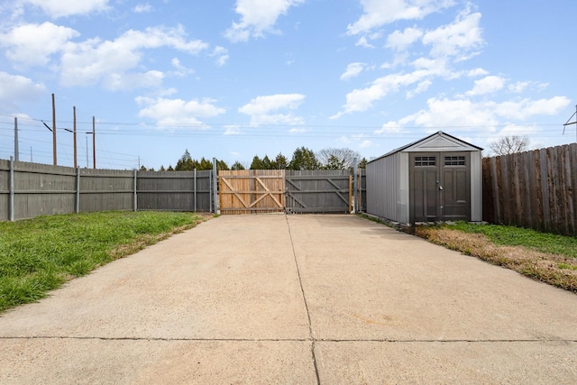 view of gate featuring a storage shed