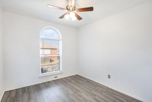 unfurnished room with crown molding and dark wood-type flooring