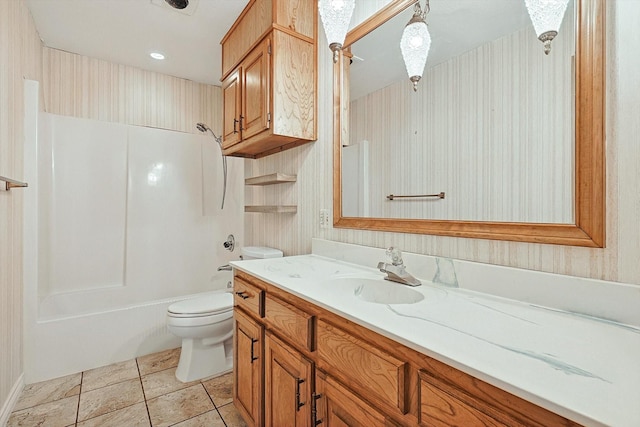 full bathroom featuring bathing tub / shower combination, vanity, and toilet