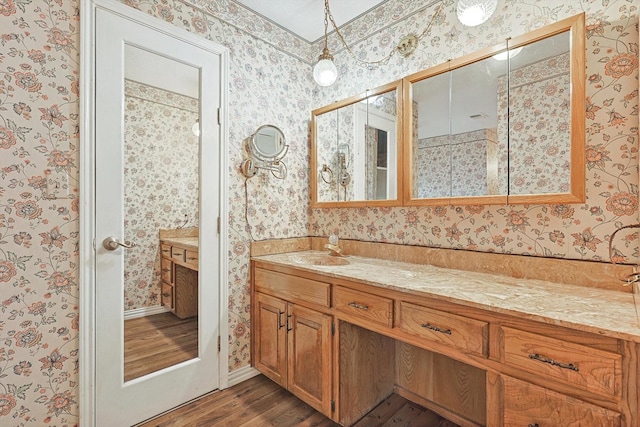 bathroom with wood-type flooring and vanity