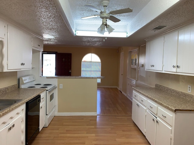 kitchen with white electric stove, black dishwasher, and white cabinets