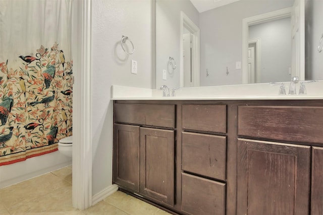 bathroom with tile patterned floors, shower / bath combo, and vanity