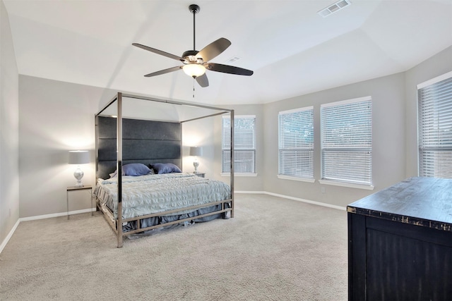 bedroom with ceiling fan, light colored carpet, and lofted ceiling