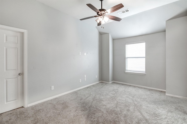 carpeted empty room featuring ceiling fan