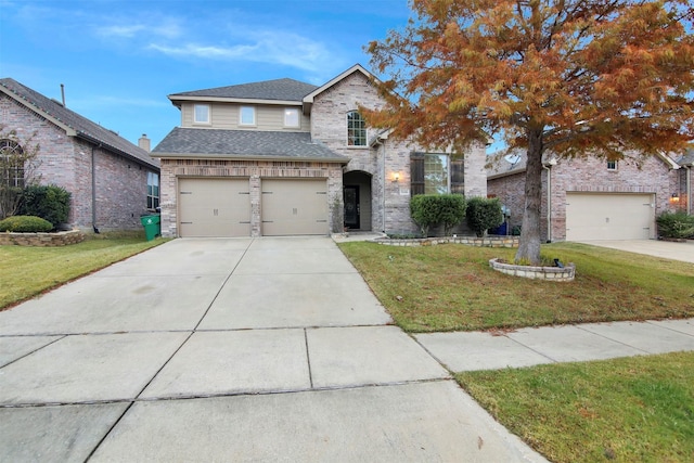 front facade with a garage and a front yard