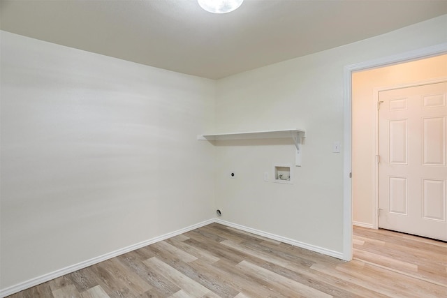 laundry area with hookup for an electric dryer, hookup for a washing machine, and light wood-type flooring