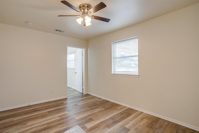 unfurnished room with ceiling fan and light hardwood / wood-style flooring