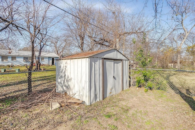 view of outbuilding with a yard