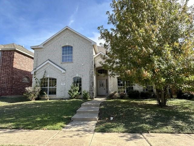 view of front of home with a front lawn