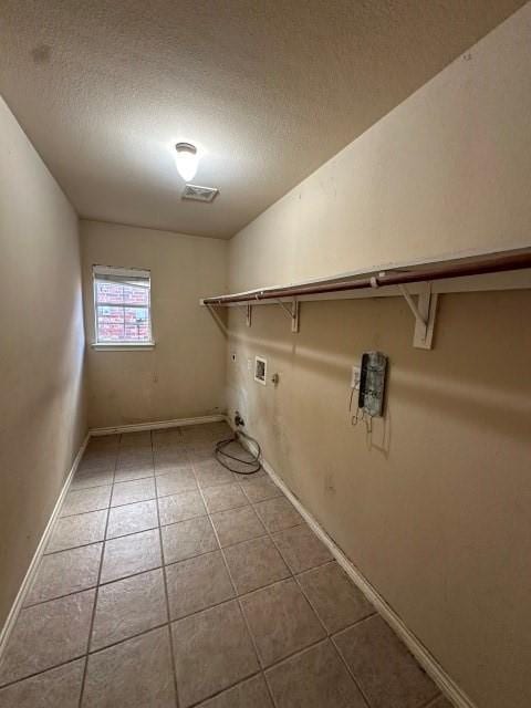 washroom featuring hookup for an electric dryer, hookup for a gas dryer, tile patterned floors, and hookup for a washing machine